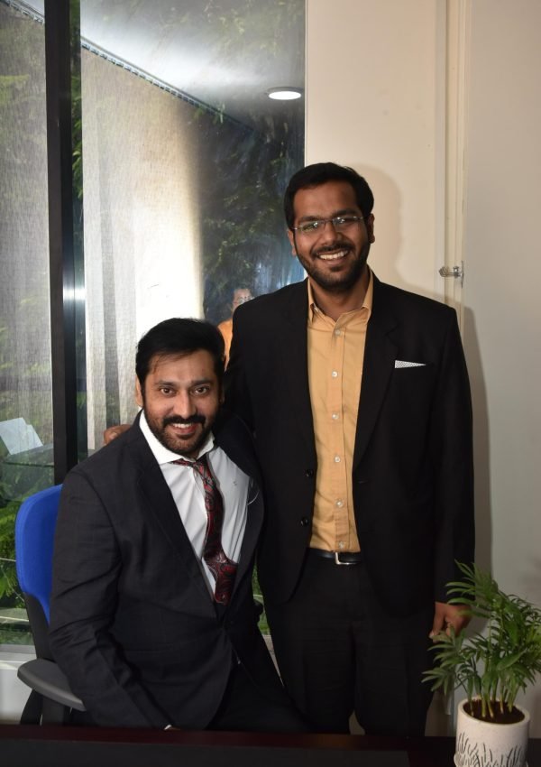 Anshul Agrawal audiologist with team member at Agrawal Hearing and Speech Clinic Indore